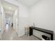 Spacious hallway with tile floors and open floor plan at 32241 Turtle Grace Loop, Wesley Chapel, FL 33545