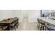 Kitchen with island and breakfast bar, open to dining area at 32241 Turtle Grace Loop, Wesley Chapel, FL 33545