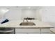 Kitchen island with granite countertop and stainless steel sink at 32241 Turtle Grace Loop, Wesley Chapel, FL 33545