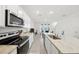 Modern kitchen with stainless steel appliances and an island at 32241 Turtle Grace Loop, Wesley Chapel, FL 33545