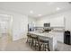Modern kitchen with island, granite counters, and stainless steel appliances at 32241 Turtle Grace Loop, Wesley Chapel, FL 33545