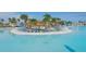 Expansive lagoon pool with sandy beach and lounge chairs at 32241 Turtle Grace Loop, Wesley Chapel, FL 33545