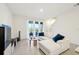 Spacious living room with sectional sofa and access to patio at 32241 Turtle Grace Loop, Wesley Chapel, FL 33545