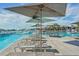 Spacious pool deck with lounge chairs and umbrellas at 32241 Turtle Grace Loop, Wesley Chapel, FL 33545