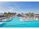 Resort-style pool with lounge chairs and shade umbrellas at 32241 Turtle Grace Loop, Wesley Chapel, FL 33545