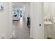 Powder room with pedestal sink and view into living area at 32241 Turtle Grace Loop, Wesley Chapel, FL 33545