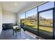 Screened patio with outdoor furniture and view at 32241 Turtle Grace Loop, Wesley Chapel, FL 33545