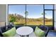 Screened patio with seating and backyard view at 32241 Turtle Grace Loop, Wesley Chapel, FL 33545