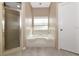 Bathroom with shower, bathtub, and tile flooring at 3404 Shady Brook Ln, Sarasota, FL 34243