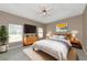 Main bedroom with a comfortable bed, dresser, and neutral-toned decor at 3404 Shady Brook Ln, Sarasota, FL 34243