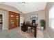 Home office with built-in shelves and desk at 3404 Shady Brook Ln, Sarasota, FL 34243
