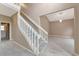 Clean staircase with a neutral color scheme and a view into a living area at 3404 Shady Brook Ln, Sarasota, FL 34243