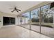 Bright sunroom with tile floor and view of patio at 3404 Shady Brook Ln, Sarasota, FL 34243