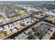 Wide aerial view showing the property's location near a waterway at 355 Moorings Cove Dr # 355, Tarpon Springs, FL 34689
