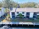 Aerial view of waterfront property with private dock at 355 Moorings Cove Dr # 355, Tarpon Springs, FL 34689