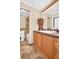 Bathroom with tile flooring, shower/tub combo, and wood vanity at 355 Moorings Cove Dr # 355, Tarpon Springs, FL 34689