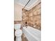 Clean bathroom with updated bathtub and tile surround at 355 Moorings Cove Dr # 355, Tarpon Springs, FL 34689