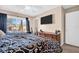 King bedroom with water view and flat-screen TV at 355 Moorings Cove Dr # 355, Tarpon Springs, FL 34689