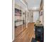 Bright hallway with mirrored closet doors and wood-look flooring at 355 Moorings Cove Dr # 355, Tarpon Springs, FL 34689