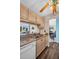 Kitchen with light wood cabinets, granite counters, and a dishwasher at 355 Moorings Cove Dr # 355, Tarpon Springs, FL 34689