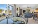 Living room with water views and comfy seating at 355 Moorings Cove Dr # 355, Tarpon Springs, FL 34689