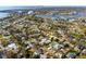 Aerial view of a single-Gathering home with a spacious yard, located in a residential neighborhood at 4000 Huntington Ne St, St Petersburg, FL 33703