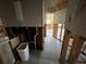A view of a bathroom under renovation, showing exposed plumbing and tile flooring at 4000 Huntington Ne St, St Petersburg, FL 33703
