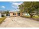 Ranch home with a spacious driveway and mature tree at 4000 Huntington Ne St, St Petersburg, FL 33703