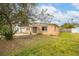 Light peach single story house with a small front yard at 4000 Huntington Ne St, St Petersburg, FL 33703
