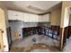Renovation in progress, kitchen with new cabinets and damaged floor at 4000 Huntington Ne St, St Petersburg, FL 33703