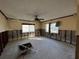 A living room undergoing renovation, showing exposed walls and flooring at 4000 Huntington Ne St, St Petersburg, FL 33703