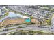 Aerial view of community with lake, playground, and basketball court at 5629 Maidenstone Way, Palmetto, FL 34221