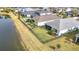 Aerial view of house, backyard, pool, and lake at 5629 Maidenstone Way, Palmetto, FL 34221