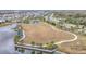 Aerial view of parkland with playground and lake access at 5629 Maidenstone Way, Palmetto, FL 34221