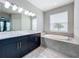 Spa-like bathroom with double vanity and large garden tub at 5629 Maidenstone Way, Palmetto, FL 34221