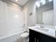 Clean bathroom with a shower/tub combo, vanity with a marble countertop, and toilet at 5629 Maidenstone Way, Palmetto, FL 34221