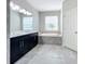 Bathroom features a double vanity, garden tub, and separate shower at 5629 Maidenstone Way, Palmetto, FL 34221