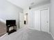 Well-lit bedroom with double doors leading to the bathroom at 5629 Maidenstone Way, Palmetto, FL 34221