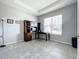 Bright home office featuring built-in shelving and wood desk at 5629 Maidenstone Way, Palmetto, FL 34221