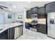 Modern kitchen with stainless steel appliances and granite countertops at 5629 Maidenstone Way, Palmetto, FL 34221