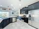 Modern kitchen with stainless steel appliances and granite countertops at 5629 Maidenstone Way, Palmetto, FL 34221