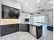 Modern kitchen with dark cabinetry and granite countertops at 5629 Maidenstone Way, Palmetto, FL 34221