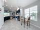 Kitchen nook with glass-top table and two chairs, near kitchen at 5629 Maidenstone Way, Palmetto, FL 34221