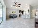 Spacious living area, open floor plan with kitchen and breakfast bar at 5629 Maidenstone Way, Palmetto, FL 34221