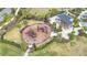 playground with play structures and shaded seating at 5629 Maidenstone Way, Palmetto, FL 34221