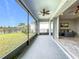 Spacious screened porch overlooking the backyard and lake at 5629 Maidenstone Way, Palmetto, FL 34221