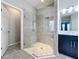 Large walk-in shower with glass enclosure and built-in seat at 5629 Maidenstone Way, Palmetto, FL 34221