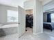 Bright walk-in closet with ample hanging space and shelving at 5629 Maidenstone Way, Palmetto, FL 34221