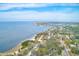 Aerial view of waterfront homes and lush coastal landscape at 604 Pennsylvania Ave, Crystal Beach, FL 34681