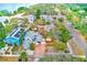 Aerial view of a charming house with a spacious backyard, located in a quiet neighborhood at 604 Pennsylvania Ave, Crystal Beach, FL 34681